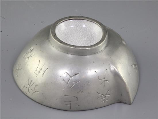 A Chinese Yixing pottery and pewter mounted peach shaped cup, late 19th century, length 13cm